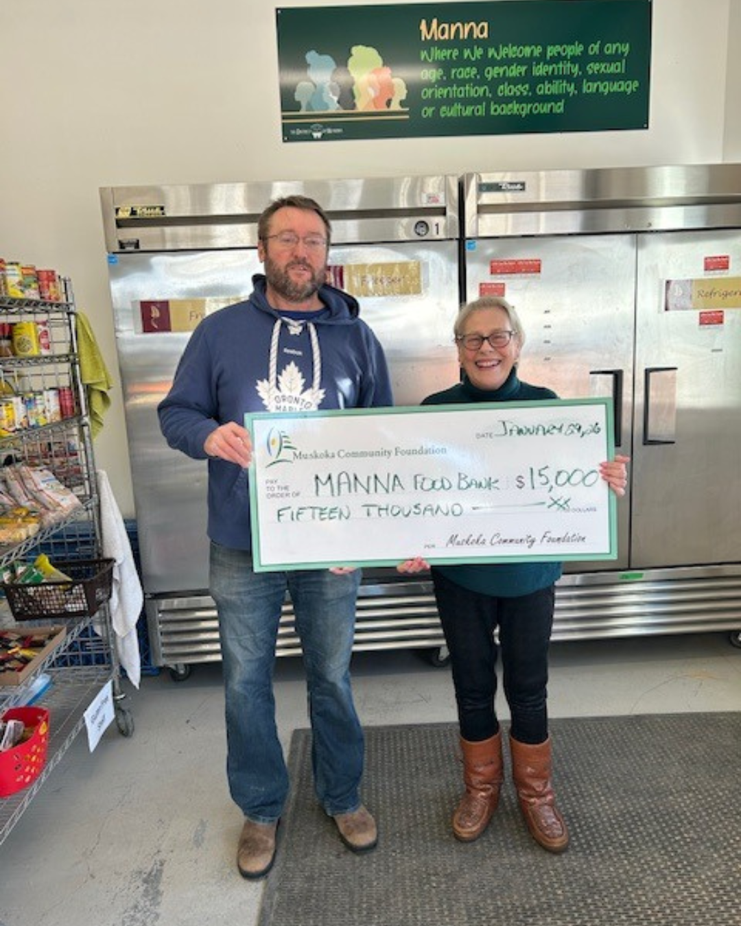 Manna Food Bank’s General Manager Brian Bobbette (left) receives a $15,000 cheque presented by Mary Ellen McIntyre (right), Executive Director of the Muskoka Community Foundation.
